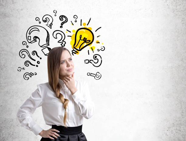 istock Pensive young woman, question marks and bulb 833752966