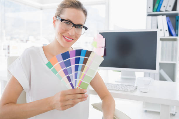 istock Female photo editor holding colors in office 833764702