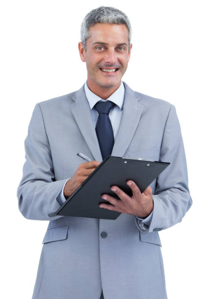 istock Joyful businessman holding clipboard and taking notes 833765304