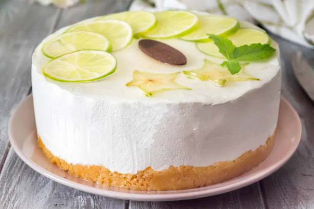 istock sweet white buttercream round cake with sliced lime on top 833771612