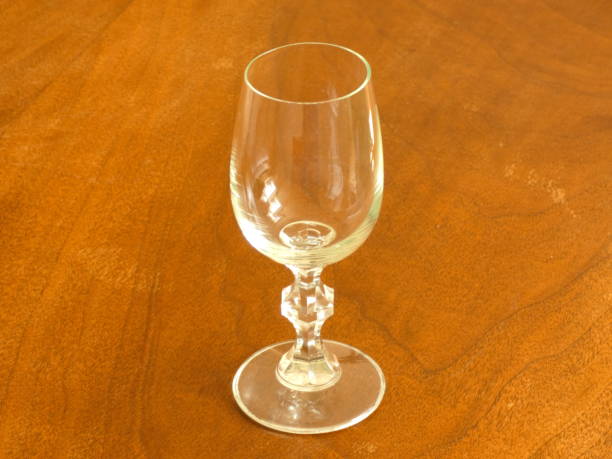istock Glass On Wooden Table 833778890