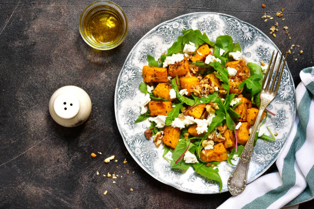 autumn pumpkin salad with feta,arugula,chard and walnut - butternut squash roasted squash cooked imagens e fotografias de stock