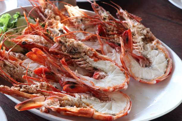 istock Half baked shrimp seafood split on white dish at Thai Restaurant 833789324