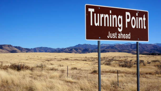 turning point just ahead  brown road sign - turning point imagens e fotografias de stock