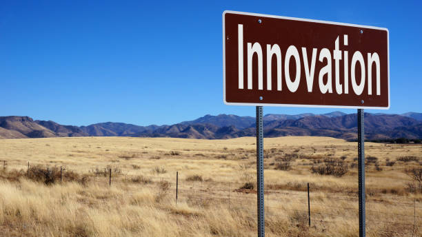 istock Innovation brown road sign with blue sky 833844786