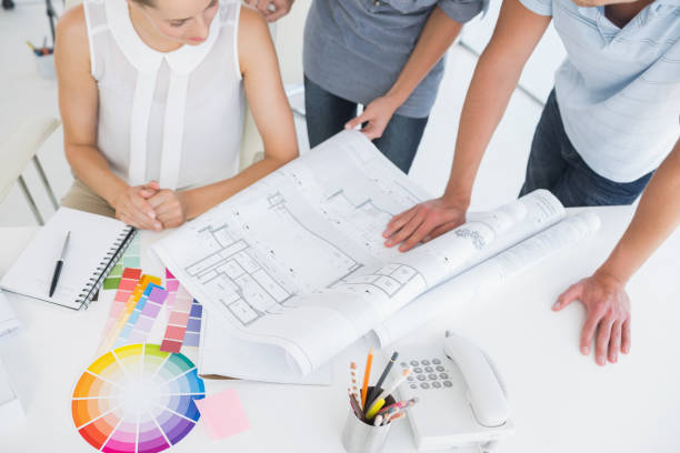 istock Mid section of artists working on designs 833851724