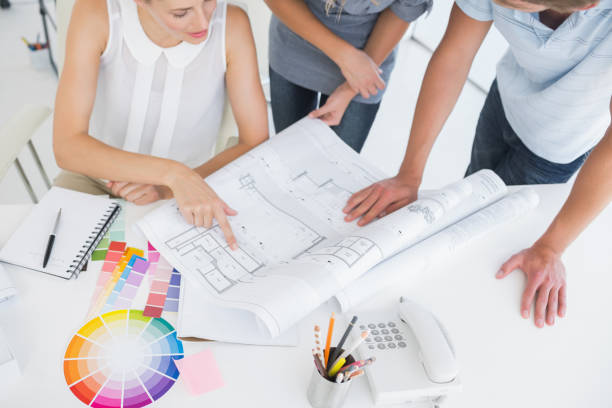 istock Mid section of artists working on designs 833851856