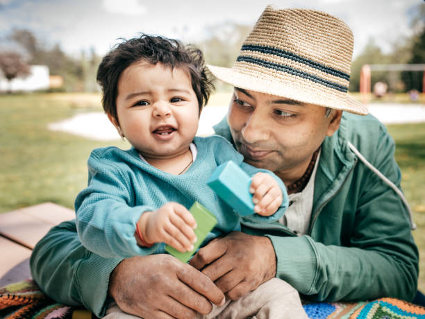 istock Father and baby in the park 833883236