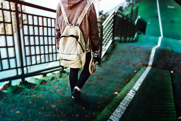 istock Young Woman Skater Walking Active Concept 833957722