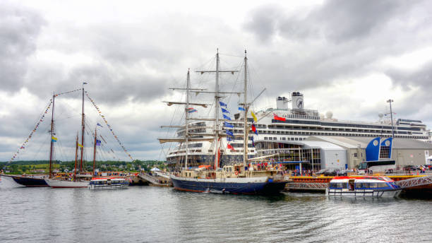 Sydney, Nova Scotia, Canada - Aug 5, 2017:  Three ships, including The Bluesnose, The Bowdoin, and The Lord Nelson  docked on the waterfront port as part of Tall Ships event.  The MS Rotterdam cruise ship is also docked at the wharf as Sydney is a regular stop for cruises.