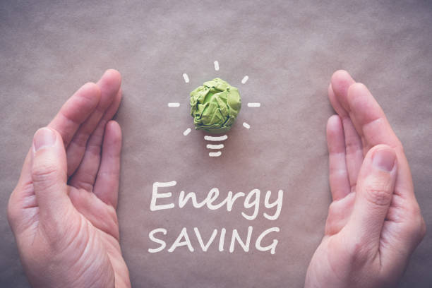 istock Green paper light bulb, eco energy saving concept 833990342