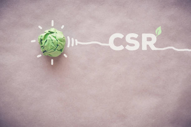 istock Green paper light bulb with CSR, Corporate social responsibility 833992140