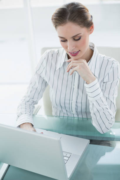 istock Gorgeous calm businesswoman working with her notebook 834021596