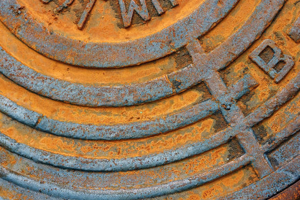 istock Fragment of an old rusty sewer hatch. 834021772