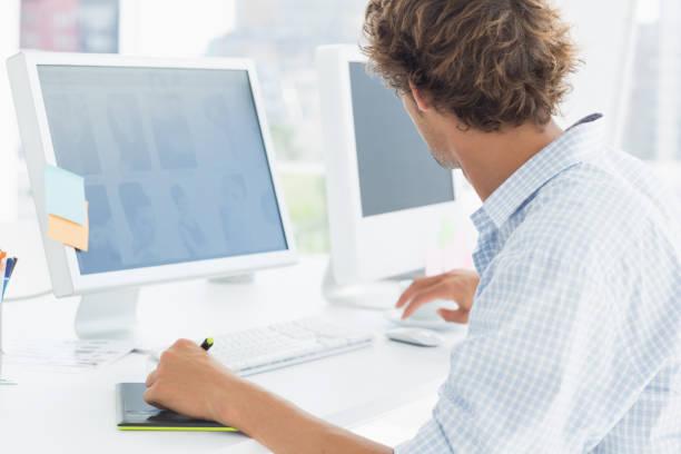 istock Artist drawing something on graphic tablet with pen 834022572