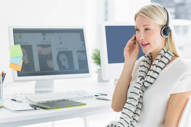 istock Casual young woman with headset in office 834036688