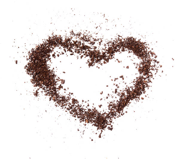 istock Crude dark coffee bean or cocoa chocolate heart shaped isolated on white background 834079680