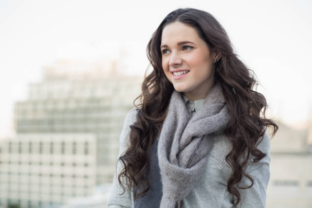 istock Cheerful pretty woman in winter clothes posing 834085630