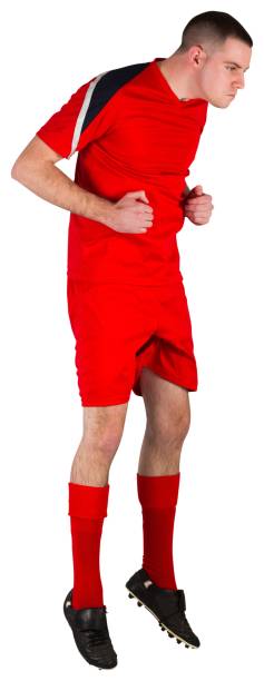 istock Fit football player jumping up 834116900