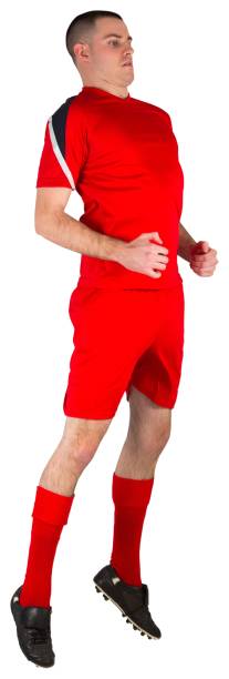 istock Fit football player jumping up 834116970