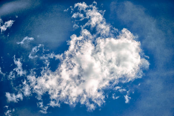 istock white clouds in a blue sky in a daytime 834121940