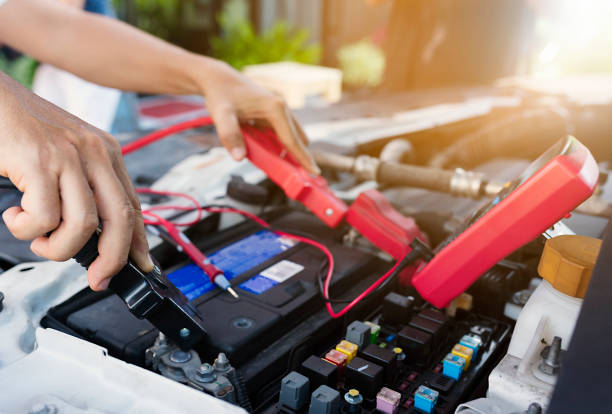 Battery. Close up of auto mechanic jumping battery car. car battery stock pictures, royalty-free photos & images