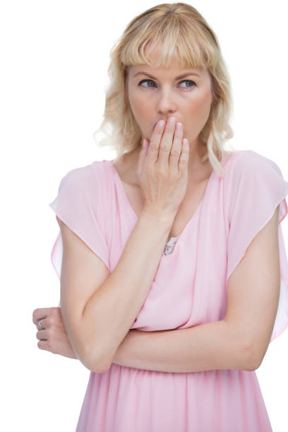 istock Blond woman putting her hand on her mouth 834124300