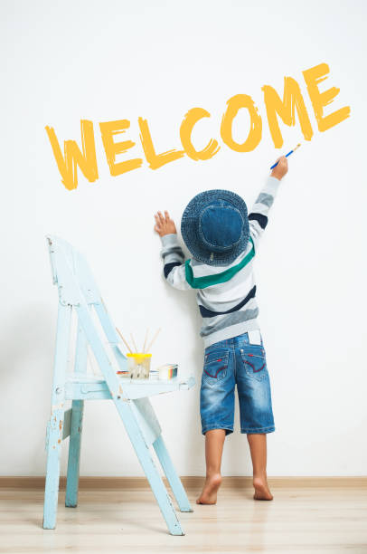 Happy child paints with paint.