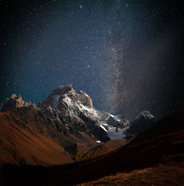 istock Night view of Ushba mountain with dark starry sky 834149764