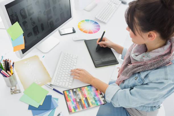 istock Artist drawing something on graphic tablet at office 834150570