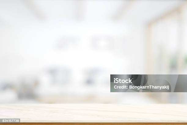 Empty Marble Table With Blurred Modern Kitchen Room Background Stock Photo - Download Image Now