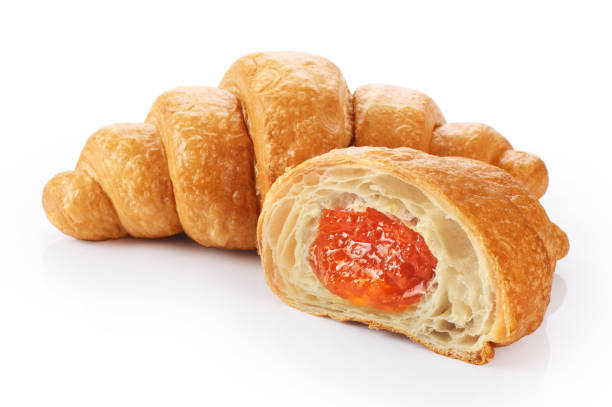 istock Sliced croissant with orange jam isolated on white background. 834166866