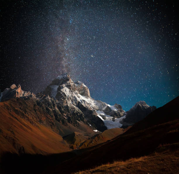 istock Night view of Ushba mountain with dark starry sky 834171552