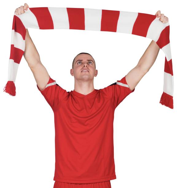 istock Football player holding striped scarf 834178148
