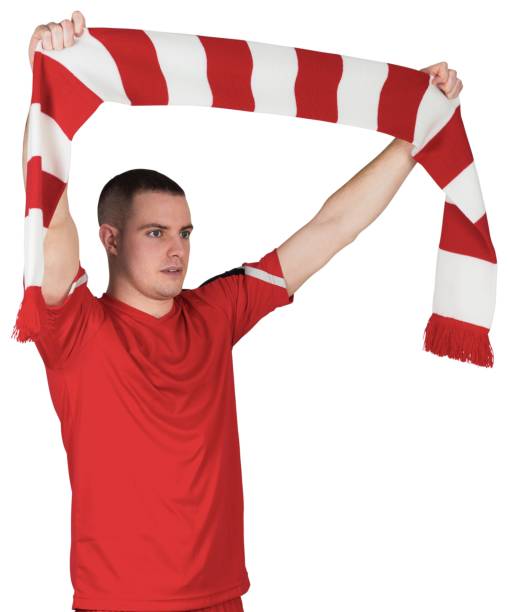 istock Football player holding striped scarf 834178252