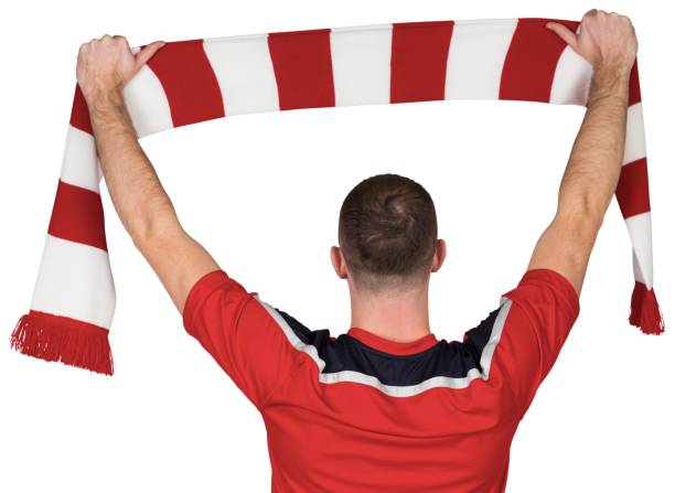 istock Football player holding striped scarf 834178288
