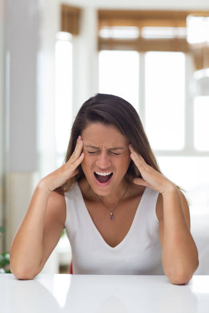 istock Stressful young woman crying from pain 834218468