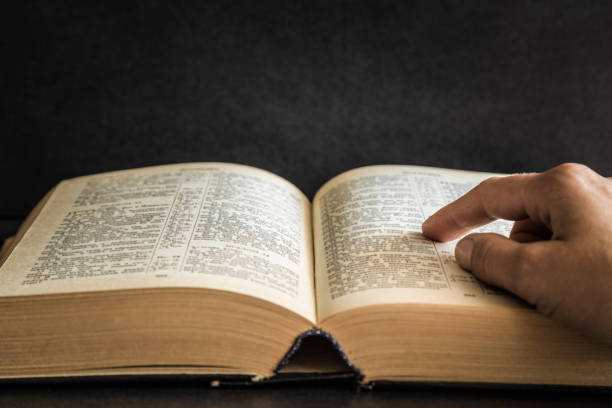istock Opened bible in the quiet, dark atmosphere. Prayer time on sunday. 834231368