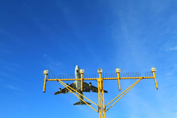 istock Airport landing lights with airplane approaching runway lighting 834241808