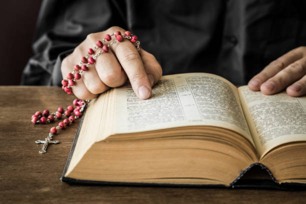 istock Opened bible in the quiet, dark atmosphere. Prayer time on sunday. 834244124