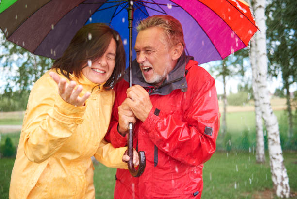 istock Marriage holding colorful umbrella 834262690
