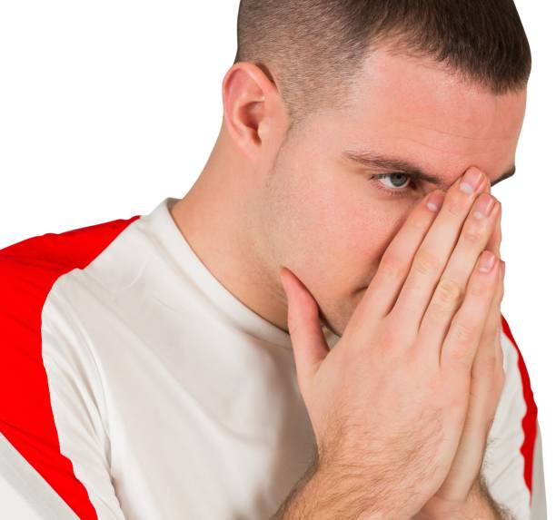 istock Disappointed football player looking down 834262794