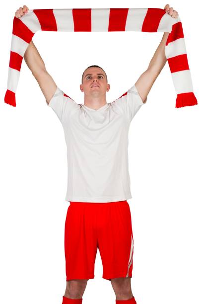 istock Football player holding striped scarf 834263262