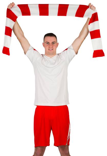 istock Football player holding striped scarf 834263290