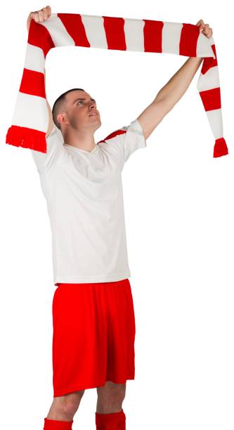 istock Football player holding striped scarf 834263370