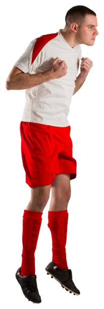 istock Fit football player jumping up 834263770
