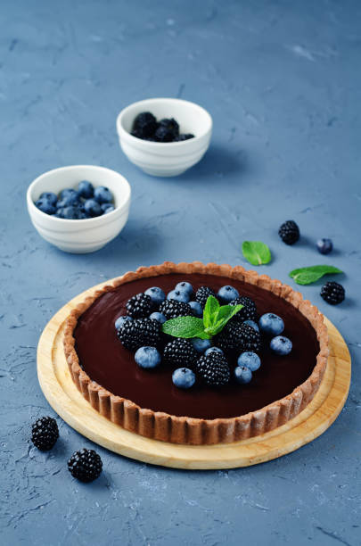 istock Chocolate tart with blackberries and blueberries 834264052