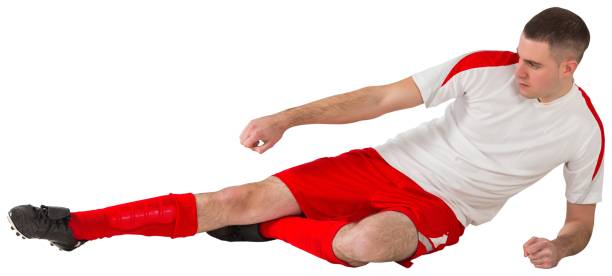 istock Fit football player playing and kicking 834264304