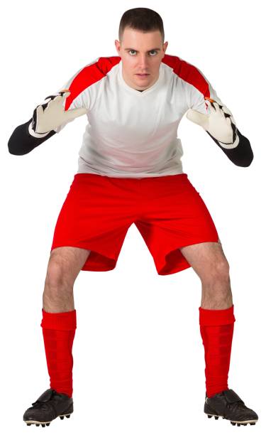 istock Goalkeeper in red and white ready to catch 834264400