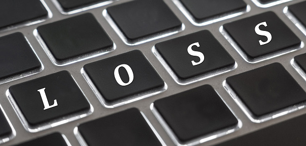 The white letter of Loss on computer keyboard background for design in your Presentation